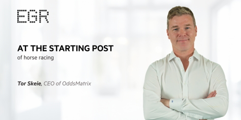 Tor Skeie, CEO of OddsMatrix, standing confidently with arms crossed, featured in an EGR promotional graphic titled 'At the Starting Post of Horse Racing